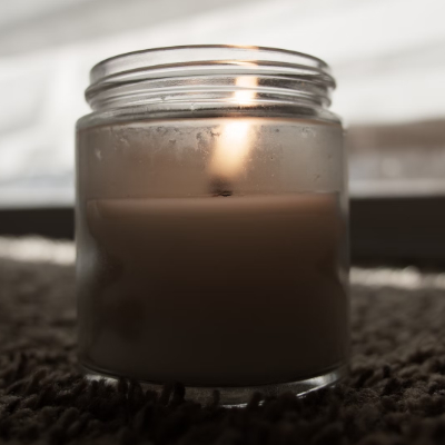 Photo of jar candle without topper and uneven burning